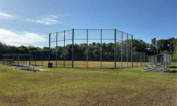 A baseball field with bleachers on either side