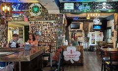 The indoor dining area with Irish decor on the walls