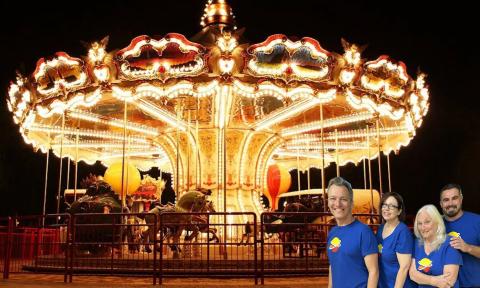 A carousel with four perfomers in the corner