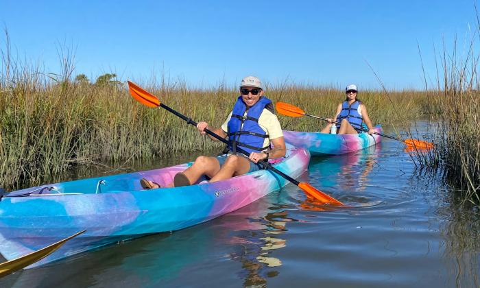Two people in kayaks exploring the Nocatee marsh