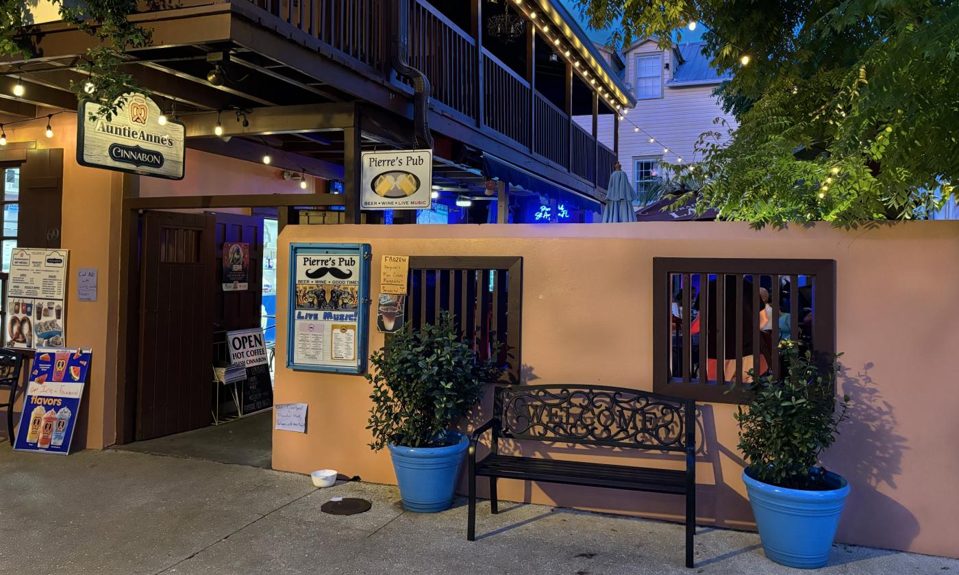 The exterior of Pierre's Pub at night